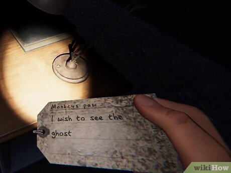 how to use the monkey paw in phasmophobia